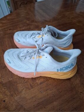 Hoka Women's White Running Shoes with Peach and Yellow Gradient Sole. D width